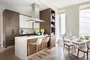 Custom kitchen cabinetry with matte black hardware, Turkish marble countertop and backsplash designed by Andre Kikoski Architect.