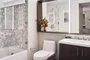 Inspired baths include a marble tub surround and glass enclosed shower, custom vanity and medicine cabinet.