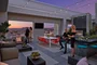 Rooftop terrace with dining tables and BBQ grills.