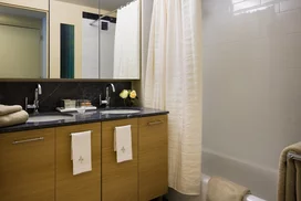 Custom bathrooms with Grigio Alfoni marble vanity tops and accents