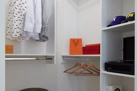 Large walk-in closets with custom shelving.