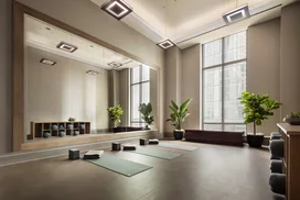 Fitness center is complimented with a yoga studio for mindfulness. 