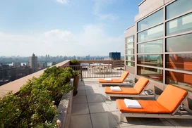 This lushly landscaped sun terrace complete with lounge chairs, tables and chairs provides the perfect setting to relax, refresh and recharge while enjoying views of the city.