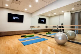 On-site yoga studio space is adjacent to the fitness center.