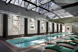 A skylit sixty foot heated swimming pool is adjacent to a state-of-the art health and fitness center. 