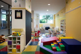 Children's playroom stocked with toys, books, and games.