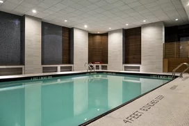 A heated swimming pool flooded with natural light, adjacent to a state-of-the-art health and fitness center, will inspire you to meet your fitness goals.