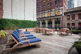 This lushly landscaped sun terrace complete with lounge chairs, tables and chairs provides the perfect setting to relax, refresh and recharge while enjoying views of the city.