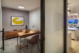 The resident-only co-working lounge includes individual workstations, private offices, and conferencing spaces.