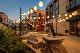 Landscaped courtyards with outdoor grills and dining