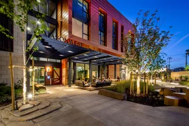 Landscaped courtyards with outdoor grills and dining