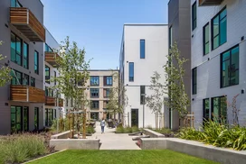 Landscaped courtyards with outdoor grills and dining