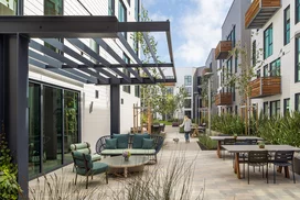 Landscaped courtyards with outdoor grills and dining