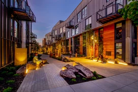 Landscaped courtyards with outdoor grills and dining