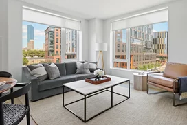 Gracious living space with hardwood floors and custom built-ins