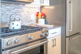 The gourmet kitchen at One Union Square South features Euro-style cabinetry and granite countertops.