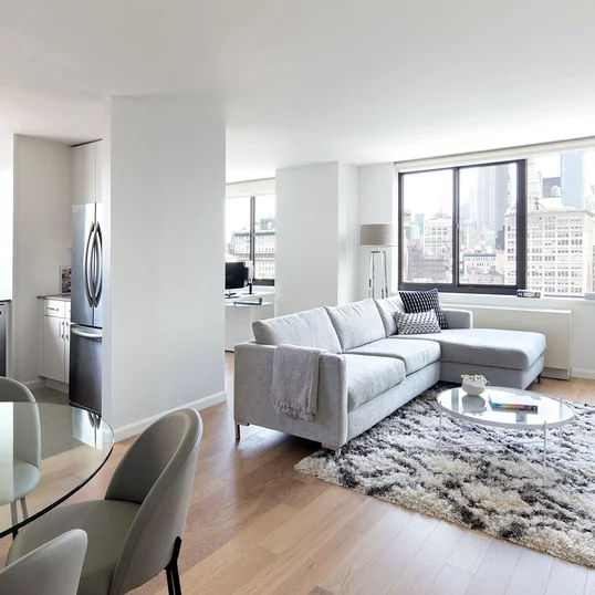 The gourmet kitchen at One Union Square South features Euro-style cabinetry and granite countertops.